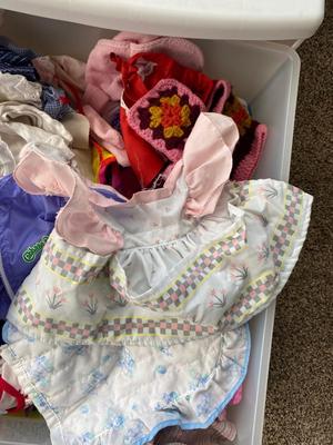 CHILD SIZE ROCKING CHAIR AND TOTE FULL OF DOLL CLOTHES