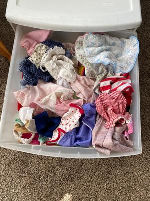 CHILD SIZE ROCKING CHAIR AND TOTE FULL OF DOLL CLOTHES