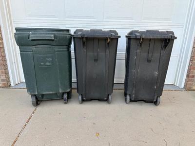 THREE 45 GALLON TRASH CANS ON WHEELS