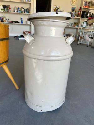 OLD MILK CAN AND A BARREL MAGAZINE STAND