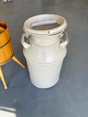 OLD MILK CAN AND A BARREL MAGAZINE STAND