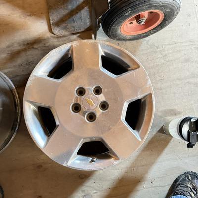 Two Custom chrome rims used on an impala plus one