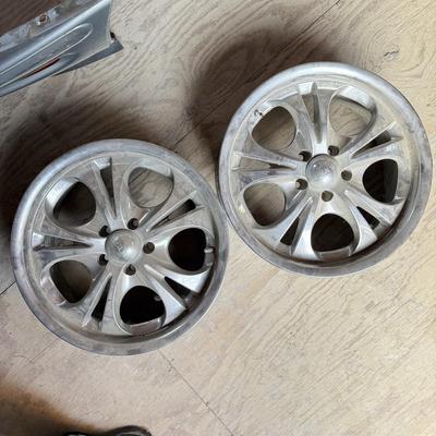 Two Custom chrome rims used on an impala plus one