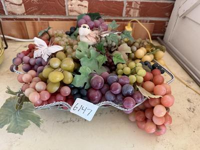 Wire basket full of grapes