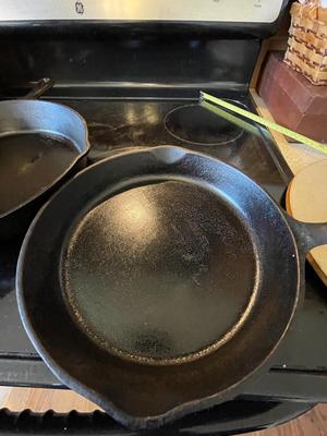 HUEY CHANG PIZZA STONE. TWO CAST IRON SKILLETS