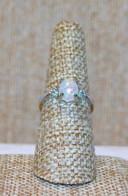 Size 7 Oval Iridescent Opal-Style Stone Ring with 3 Clear Side Stone Accents on a Silver Tone Band (2.4g)