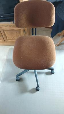 HON Adjustable office chair with a hard desk mat