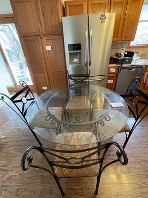 BEVELED GLASS TABLE WITH FOUR IRON CHAIRS