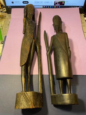 2 Vintage Ebony Hand Carved African Wood Statue Figurines w/Spears 12" & 15" in Good Preowned Condition as Pictured.