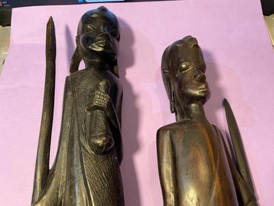 2 Vintage Ebony Hand Carved African Wood Statue Figurines w/Spears 12" & 15" in Good Preowned Condition as Pictured.