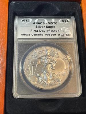 ANACS CERTIFIED 2012 MS70 FIRST DAY OF ISSUE AMERICAN SILVER EAGLE IN A CUSTOM WOODEN BOX.
