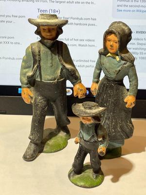 Vintage Mid-Century Cast Iron Amish Family Figurines in Good Preowned Condition.