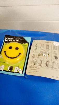 LOT 26 TWO VINTAGE SMILING FACE NIGHT LIGHTS