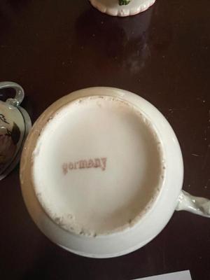 PORCELAIN CLOWN, TEAPOT FROM GERMANY, MUSTACHE CUP AND 2 HANDLED CUP
