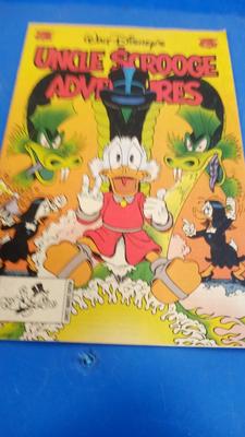LOT 31 TWO WALT DISNEY UNCLE SCROOGE COMIC BOOKS