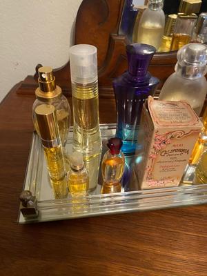 PERFUME BOTTLES ON VINTAGE MIRRORED TRAY