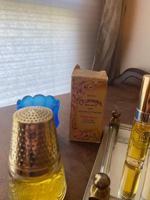 PERFUME BOTTLES ON VINTAGE MIRRORED TRAY