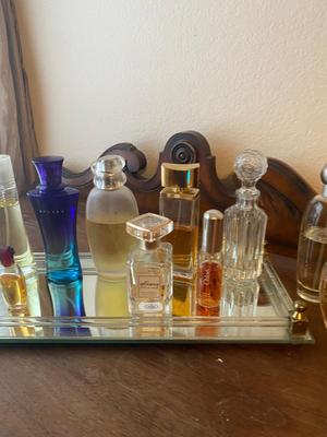 PERFUME BOTTLES ON VINTAGE MIRRORED TRAY