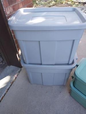 Four Rubbermaid Storage Totes