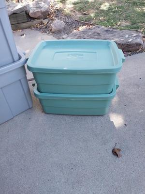 Four Rubbermaid Storage Totes