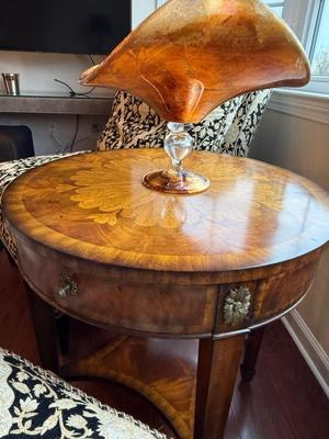 Exquisite Maitland Smith round table with bottom shelf