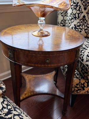 Exquisite Maitland Smith round table with bottom shelf