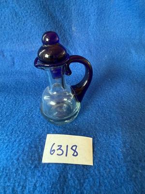 Cute little cruet with blue stopper