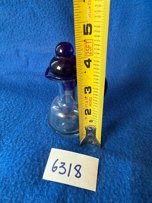 Cute little cruet with blue stopper