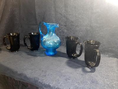 BLUE GLASS PITCHER AND BLACK TIARA HORN MUGS