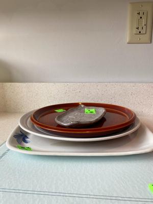 Lot of Assorted Plates and Cutting Board.