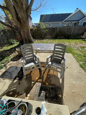 SMOKEY GLASS TOP PATIO TABLE AND TWO BIG EASY ROCKING CHAIRS
