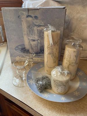 THREE PILLAR CANDLES ON DECORATIVE PLATE