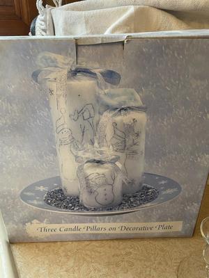 THREE PILLAR CANDLES ON DECORATIVE PLATE