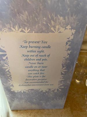 THREE PILLAR CANDLES ON DECORATIVE PLATE