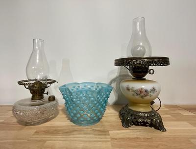 Vintage electric and oil burning lamps.