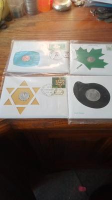 LOT 98 FOUR FIRST DAY COVERS W/COINS & STAMPS