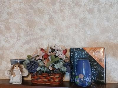 Home decor, basket of faux flowers, beautiful vase small angel and a brand-new photo album