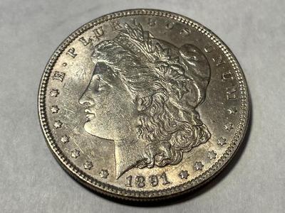1891-P AU53 CONDITION (UNCERTIFIED) MORGAN SILVER DOLLAR AS PICTURED.