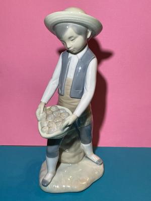 Nao by Lladro 8.5" Porcelain Farmer Boy w/Basket & Bag of Potatoes Figurine as Pictured.