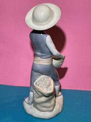 Nao by Lladro 8.5" Porcelain Farmer Boy w/Basket & Bag of Potatoes Figurine as Pictured.