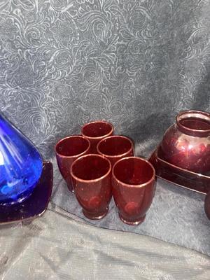 GORGEOUS RED GLASS, CHAMPAGNE GLASSES, & VINTAGE BLUE WATER BOTTLE AND VASE