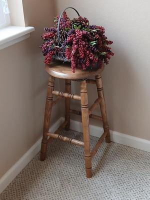 Rock Creek Woodworks Oak Swivel bar stool with arrangement in a basket