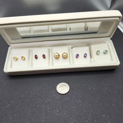 Five sets of pierced earrings