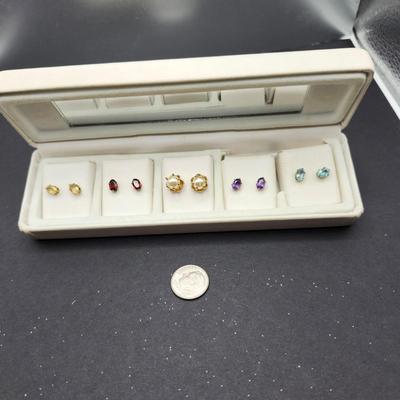 Five sets of pierced earrings
