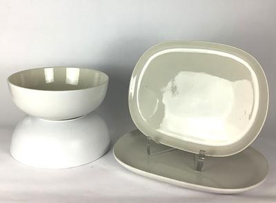 Sale Photo Thumbnail #194: This charming West Elm modern Stoneware serving set by Aaron Probyn  includes two bowls and two platters, ideal for any retro dining collection. The neutral off-white color allows them to blend seamlessly into any kitchen or dining decor. Perfect for serv