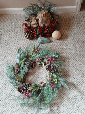 Christmas wreath with basket of holly, and pine with adorable porcupines