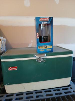 Vintage metal Coleman cooler with a Coleman classic LED lantern new in the box!