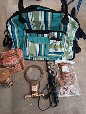 Savy caddy bag carry on size with curling iron, candle, decorative box, magnifier, and more