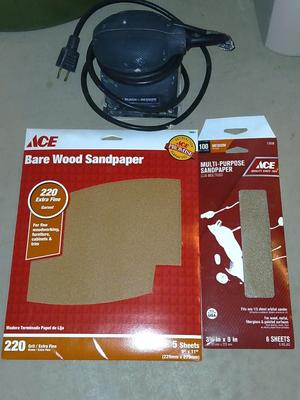 Black and decker electric sander with some sandpaper