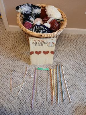 Large wicker basket with Knitting needles, and skeins of yarn - Teach yourself how to knit!